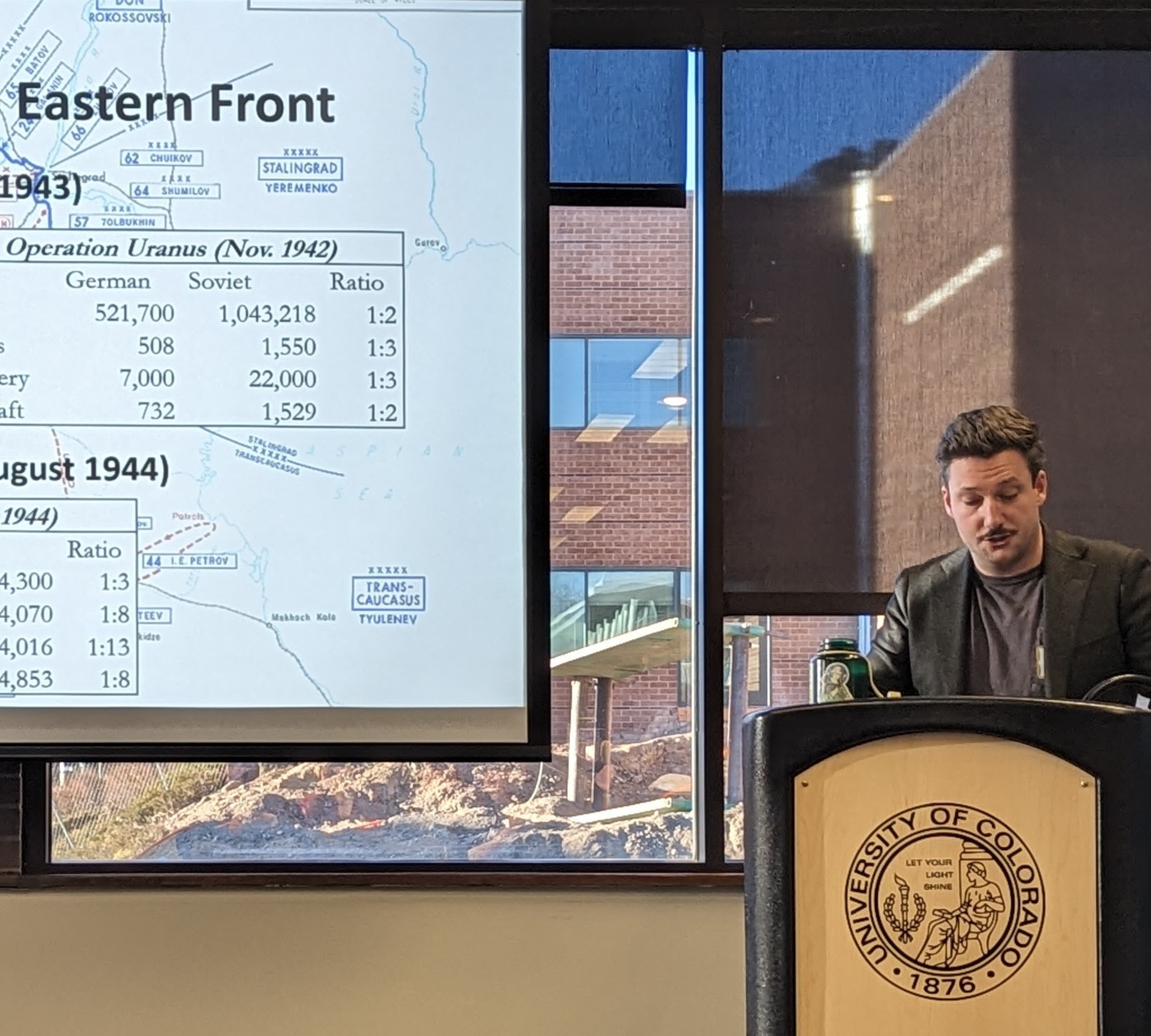 Graduate research assistant presenting original research