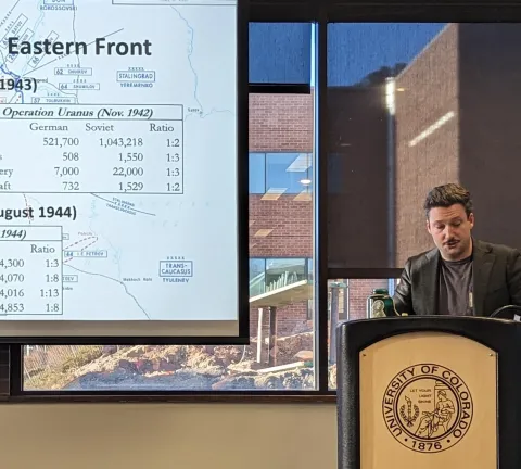 Graduate research assistant presenting original research