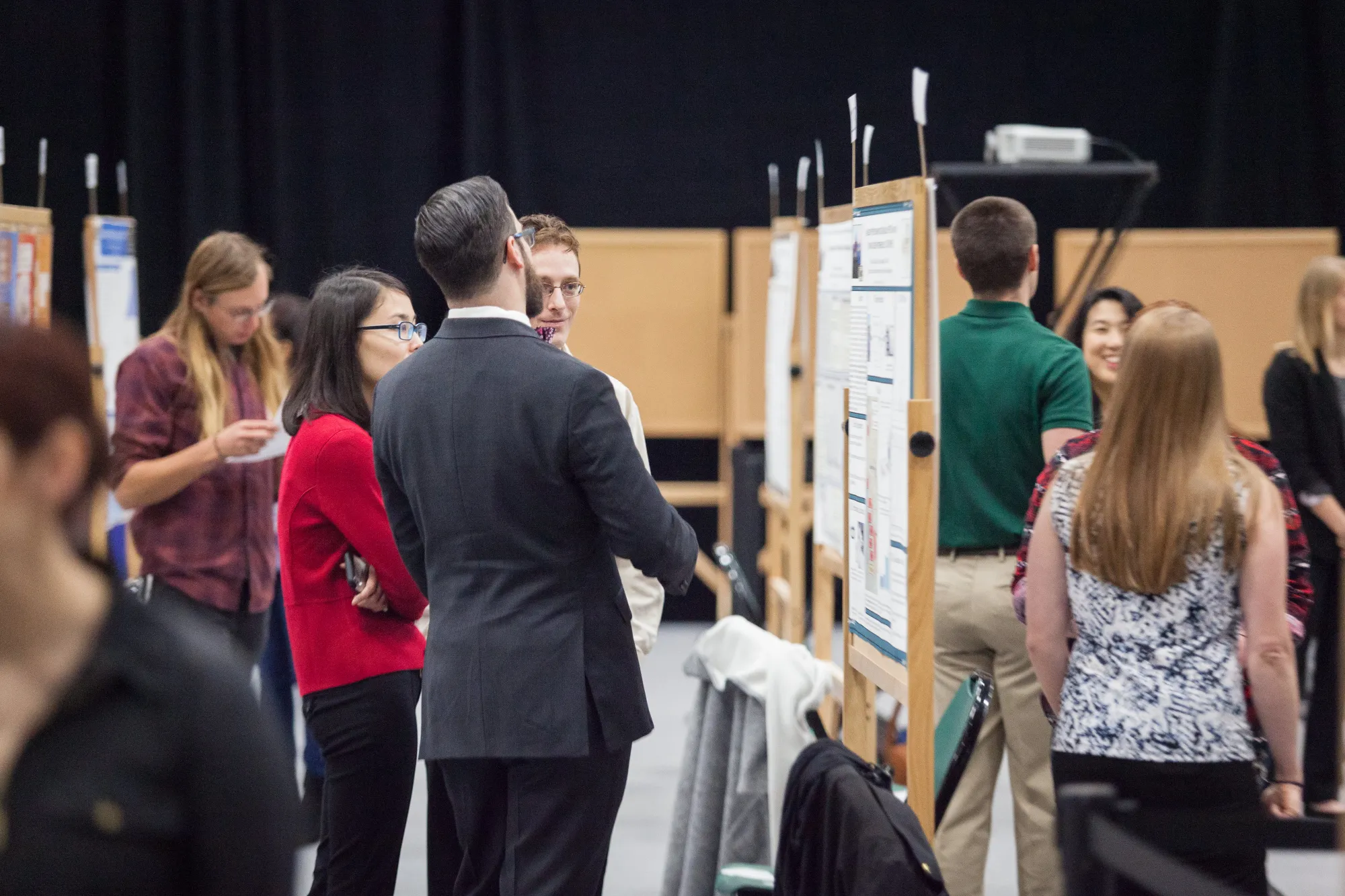 graduate student presenting their research at the UCCS research fair