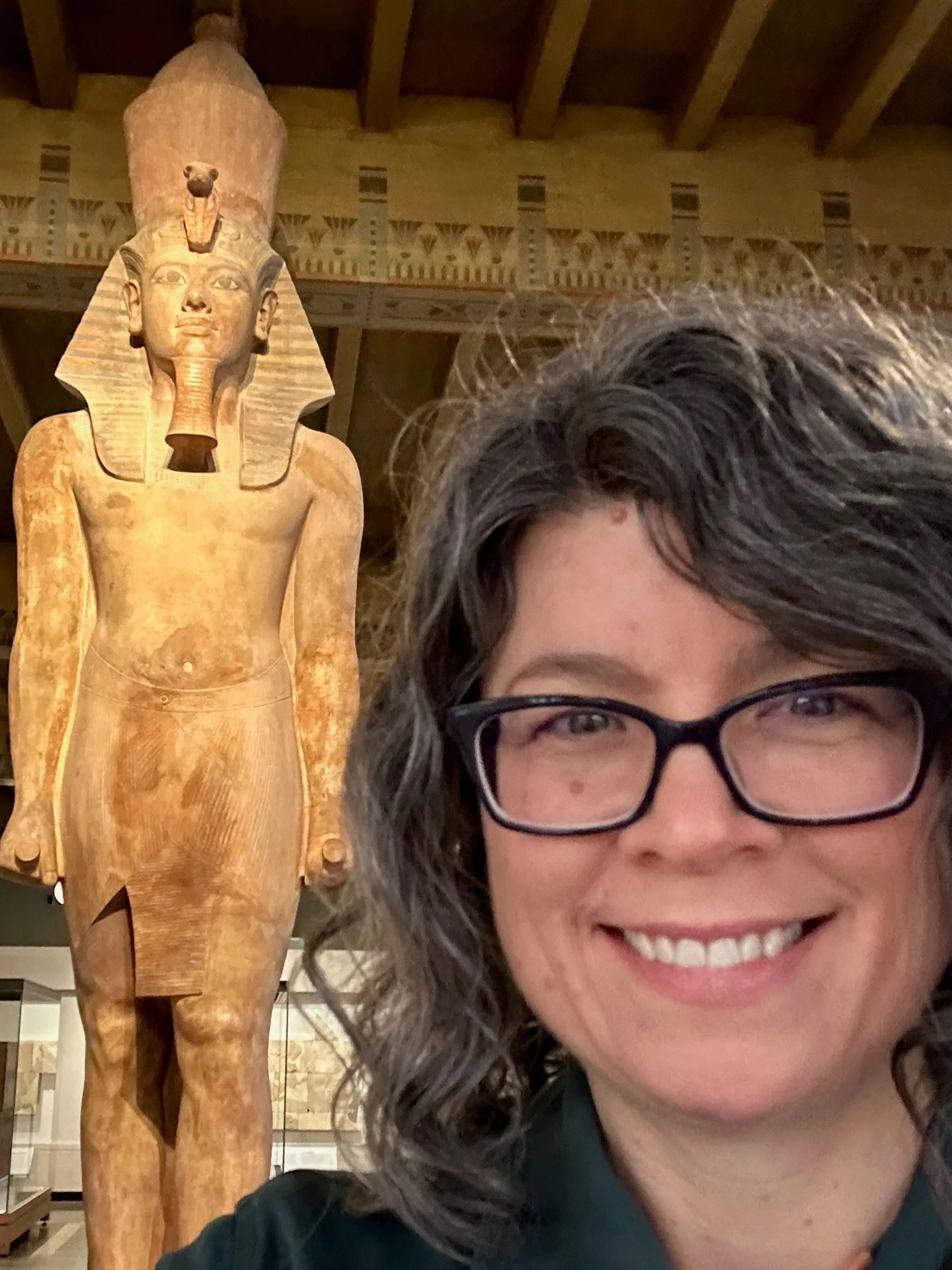 Photo of Roy Jo Sartin with an Egyptian statue in the background