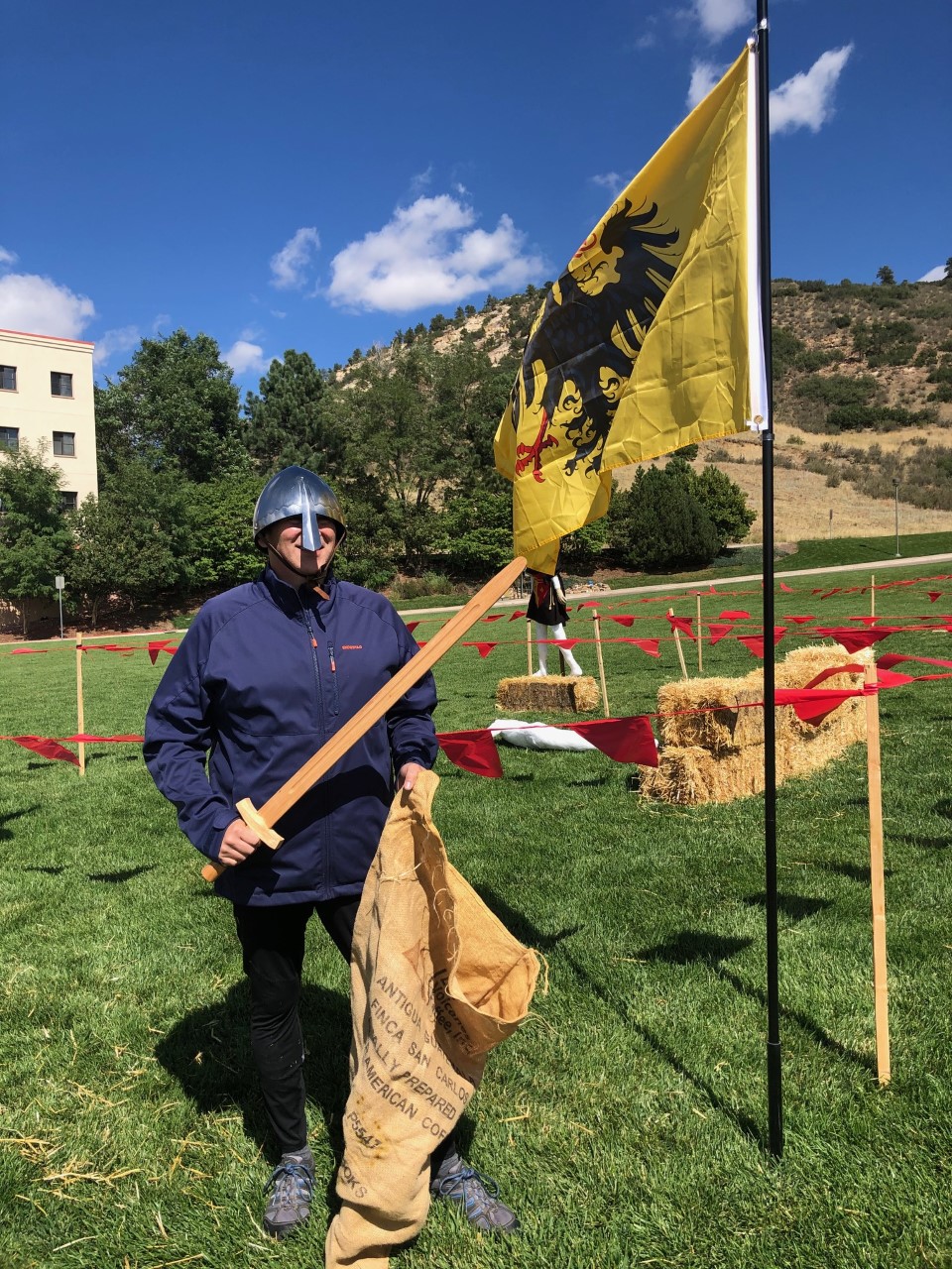 Person in medieval costume with flag